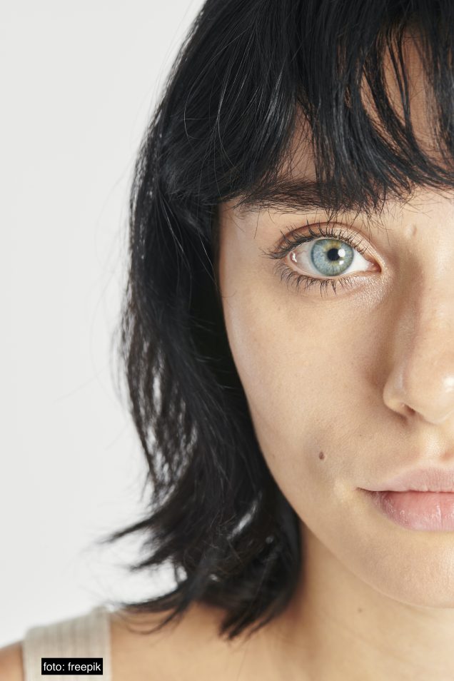 Half face beautiful woman with blue eyes